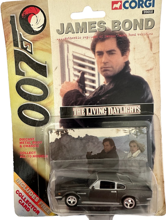 Vintage 1999 Corgi James Bond 007 - The Living Daylights - Aston Martin V8 Vantage Volante 1:65 Scale Die-Cast Vehicle Replica Number 99658 - Includes Free Collectors Card - Brand New Factory Sealed Shop Stock Room Find